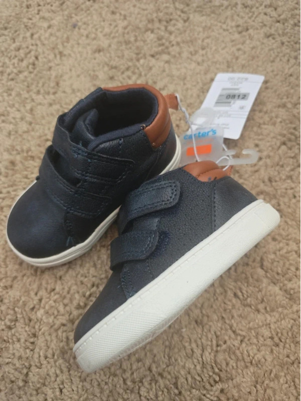 Size 4 brand new baby boots from carter's item. 812 bin 9